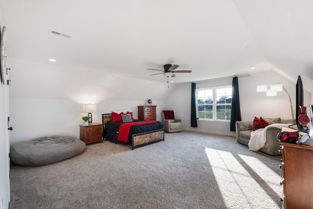 carpeted bedroom with ceiling fan and lofted ceiling