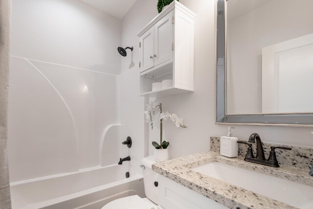 full bathroom with vanity, toilet, and shower / bathtub combination