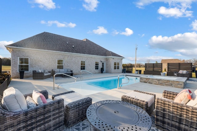 view of pool with an outdoor living space and a patio