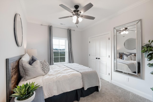 bedroom with carpet flooring, a closet, ceiling fan, and crown molding