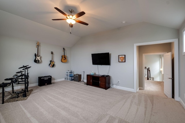 interior space with light colored carpet, vaulted ceiling, and ceiling fan