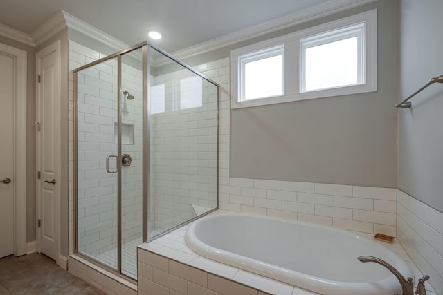 bathroom featuring shower with separate bathtub and crown molding