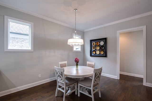 dining area featuring dark hardwood / wood-style floors and crown molding