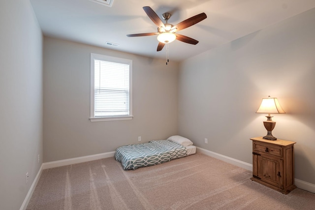 unfurnished bedroom featuring ceiling fan and light carpet