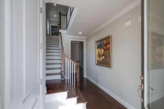 stairway featuring wood-type flooring and crown molding