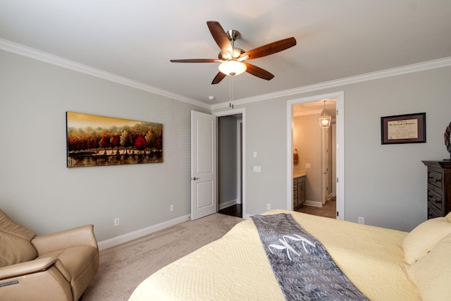 carpeted bedroom with ceiling fan, ornamental molding, and ensuite bathroom