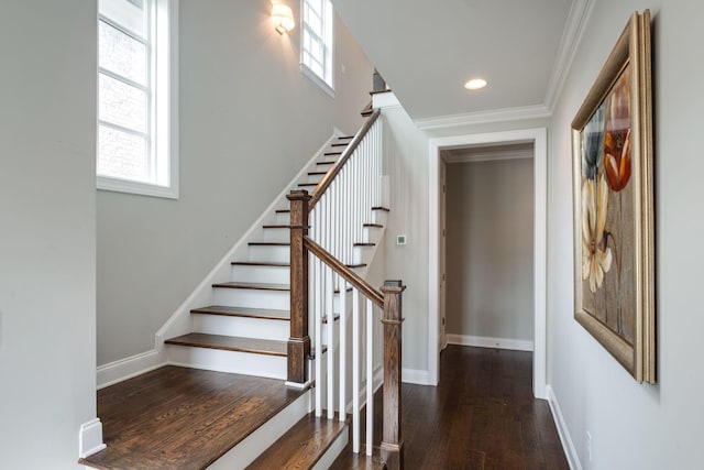 stairway featuring hardwood / wood-style floors and ornamental molding