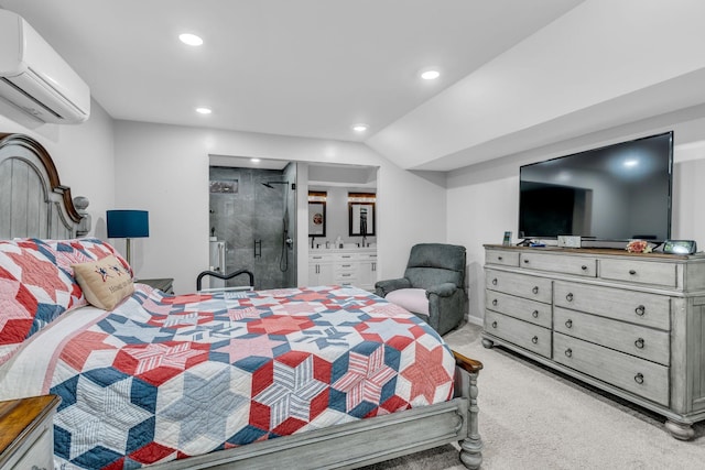 bedroom with a wall mounted air conditioner, light carpet, connected bathroom, and lofted ceiling