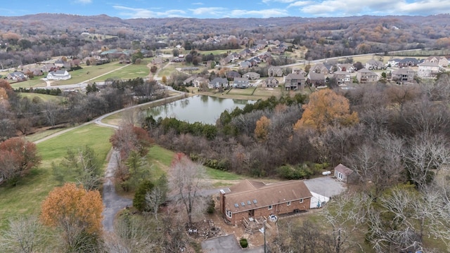 bird's eye view with a water and mountain view