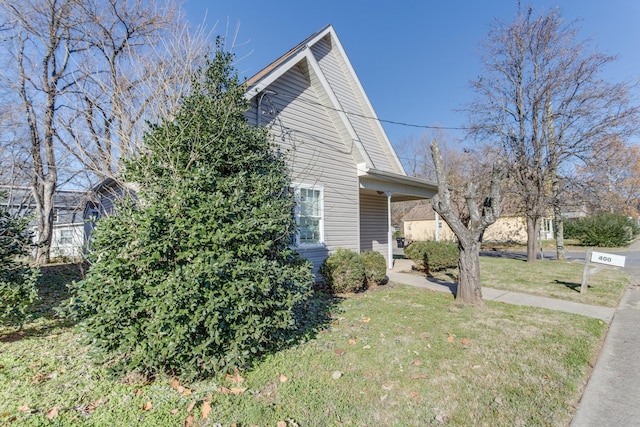 view of property exterior featuring a lawn