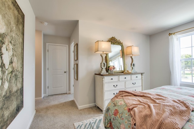 bedroom with light colored carpet