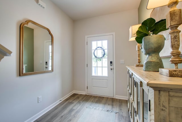 doorway to outside with hardwood / wood-style flooring