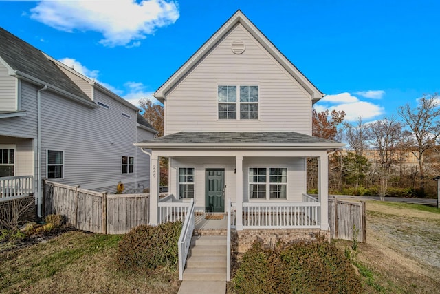 view of front property with covered porch and a front lawn