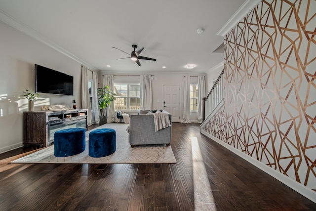 living room with crown molding, ceiling fan, and wood-type flooring