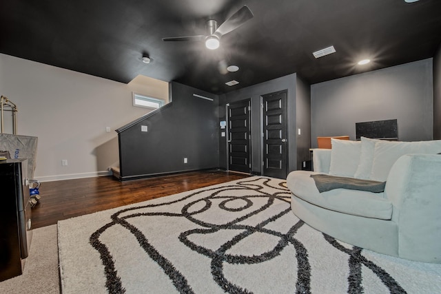 interior space featuring ceiling fan and dark wood-type flooring