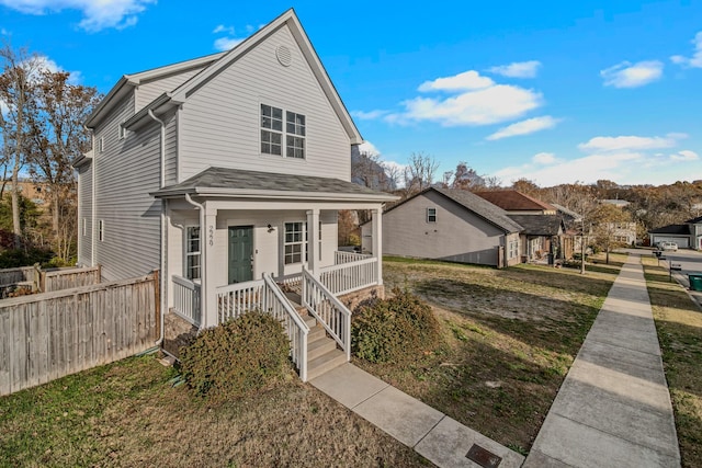 view of front property with a porch and a front yard