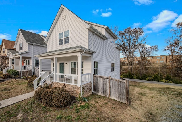 view of front of home featuring a porch and a front yard