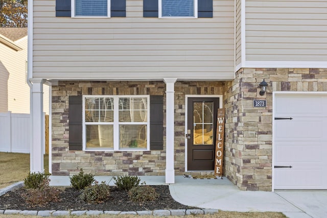 doorway to property featuring a garage