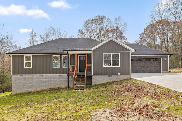 ranch-style home featuring a front lawn and a garage