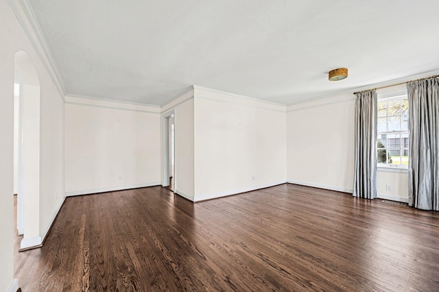 unfurnished room with crown molding and dark hardwood / wood-style flooring