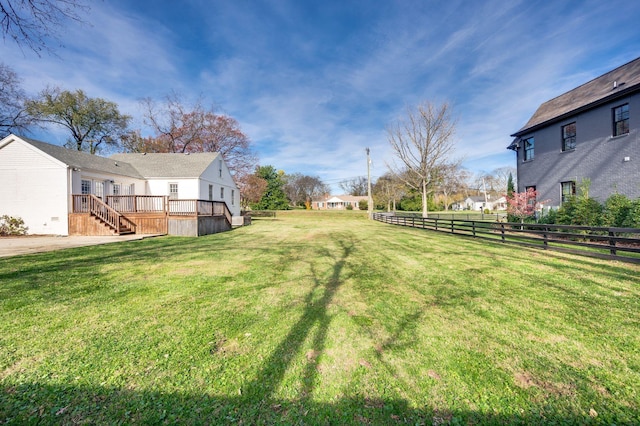 view of yard with a wooden deck