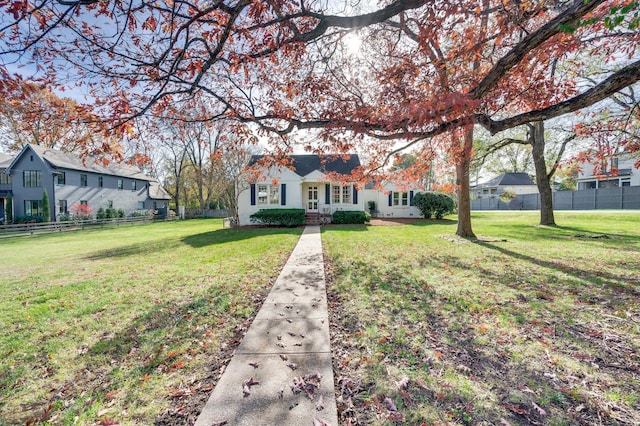 ranch-style house with a front lawn