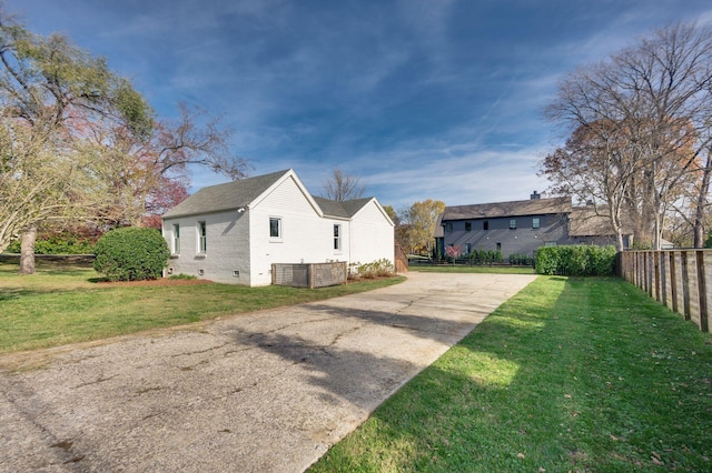 view of home's exterior with a yard