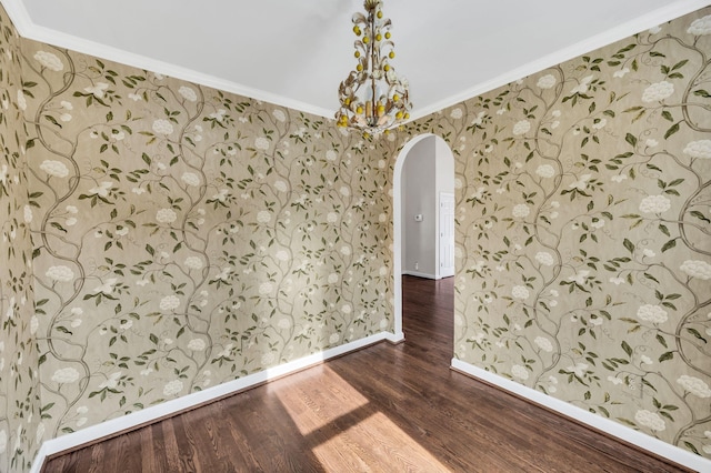 unfurnished room featuring dark hardwood / wood-style flooring and crown molding