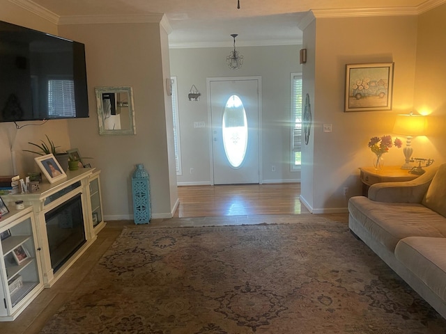 entryway featuring hardwood / wood-style flooring and ornamental molding