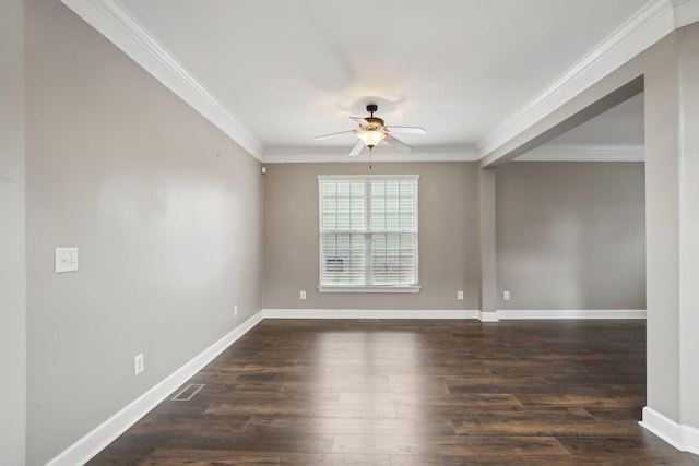 unfurnished room with ceiling fan, ornamental molding, and dark wood-type flooring