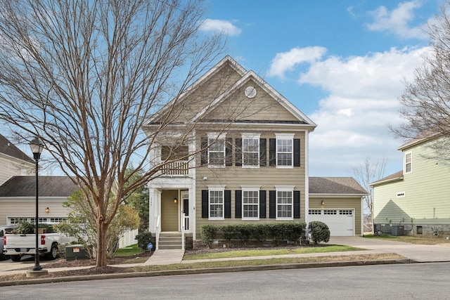 view of front of home with central AC and a garage