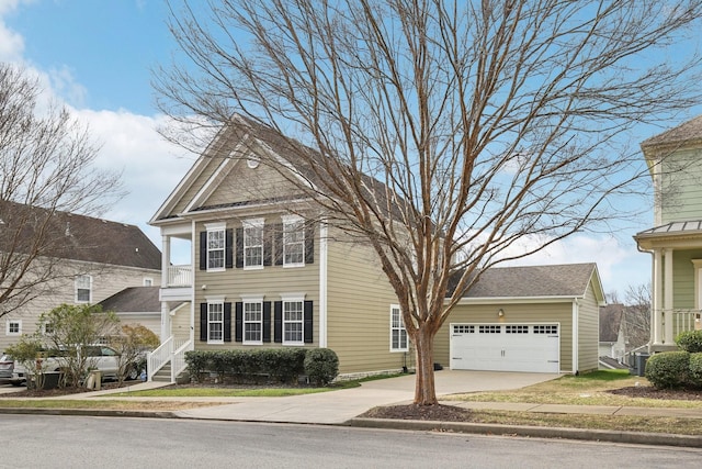 view of front of property featuring central AC unit and a garage