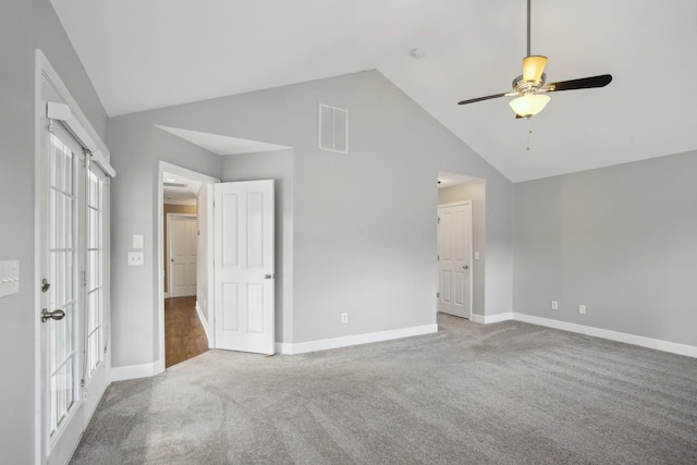 spare room featuring ceiling fan, high vaulted ceiling, and light colored carpet