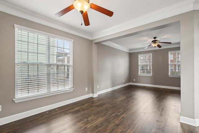 empty room with ornamental molding and dark wood-type flooring