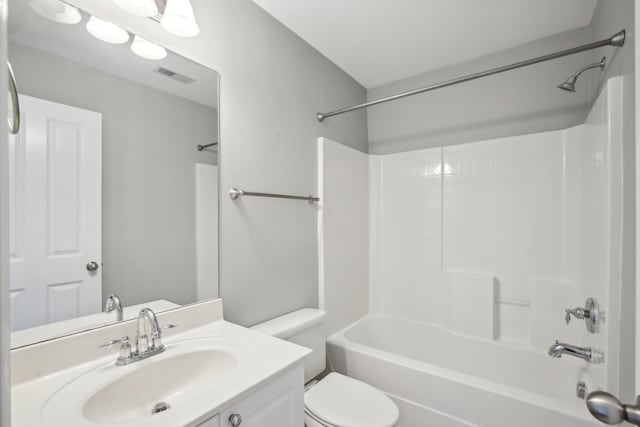 full bathroom with vanity,  shower combination, and toilet