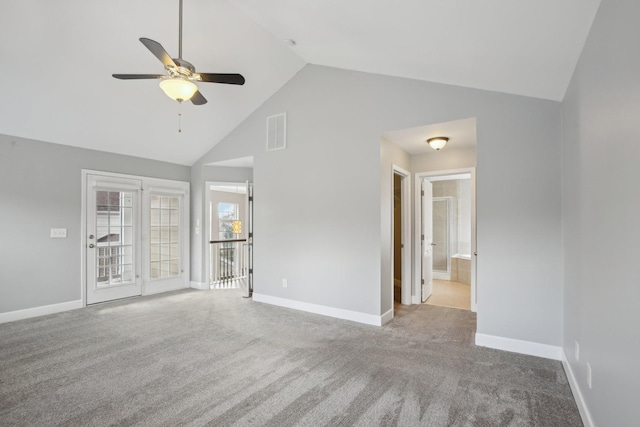 unfurnished living room with light carpet, high vaulted ceiling, and ceiling fan