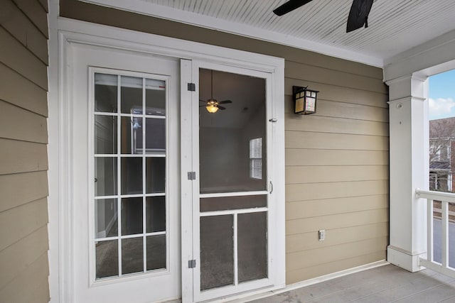 property entrance with ceiling fan