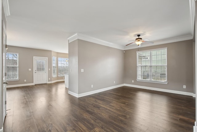 unfurnished room featuring dark hardwood / wood-style flooring, ceiling fan, plenty of natural light, and crown molding