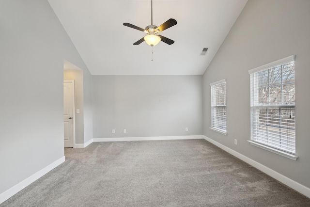 unfurnished room with ceiling fan, lofted ceiling, and carpet floors