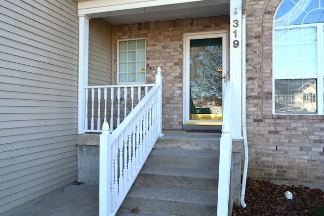 entrance to property featuring a porch