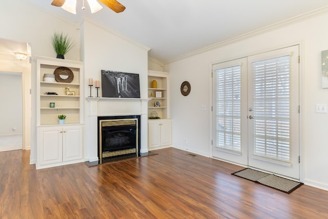 unfurnished living room with ceiling fan, dark hardwood / wood-style flooring, lofted ceiling, and ornamental molding