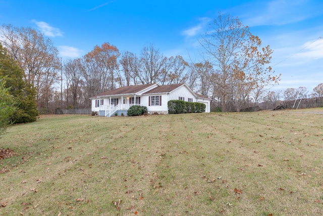 ranch-style house with a porch and a front lawn