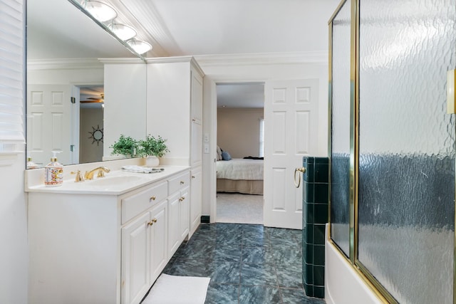 bathroom with combined bath / shower with glass door, vanity, and crown molding