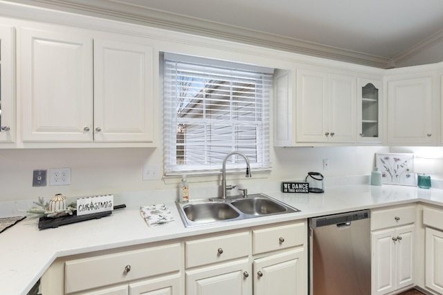 kitchen with white cabinetry, sink, stainless steel dishwasher, and ornamental molding