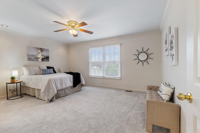 carpeted bedroom with ceiling fan and ornamental molding