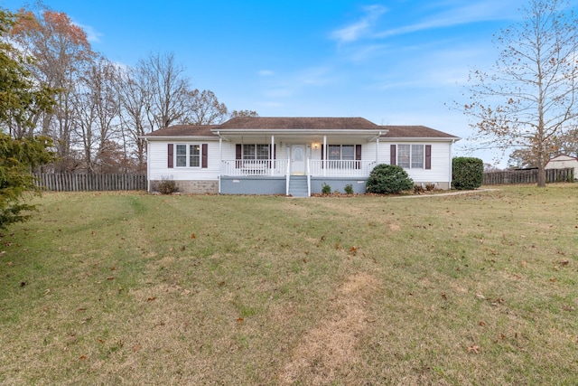 ranch-style house featuring a front lawn and covered porch