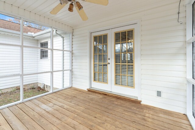 unfurnished sunroom featuring ceiling fan, french doors, and wooden ceiling