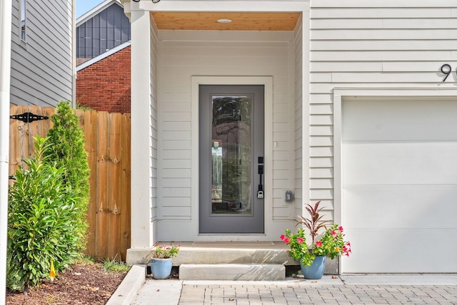 property entrance with a garage