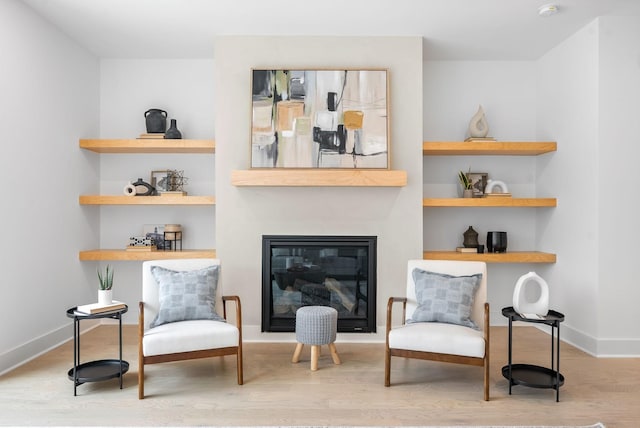 sitting room with light hardwood / wood-style flooring