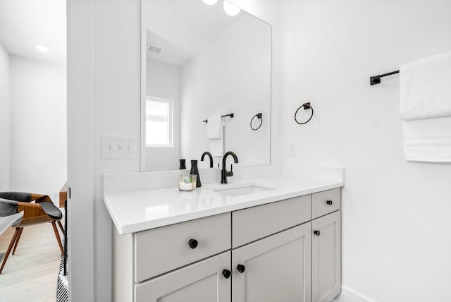 bathroom featuring wood-type flooring and vanity